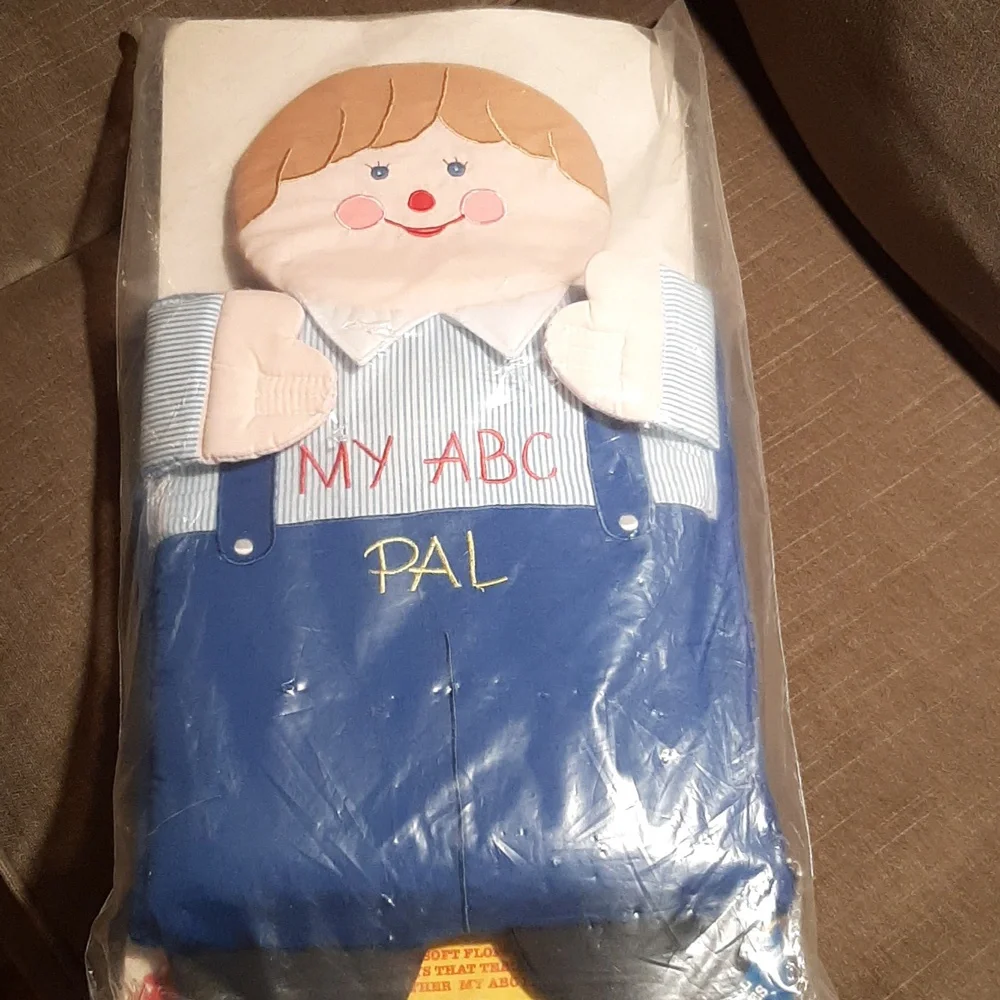 Soft sided zippered carry bag. Big soft floppy doll filled with ABC pill…
